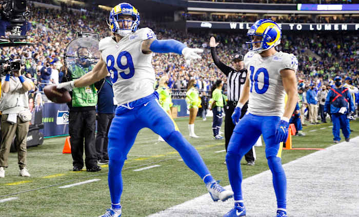 Los Angeles Rams tight end Tyler Higbee (89) celebrates with wide receiver Cooper Kupp (10) after catching a touchdown pass against the Seattle Seahawks during the third quarter at Lumen Field.